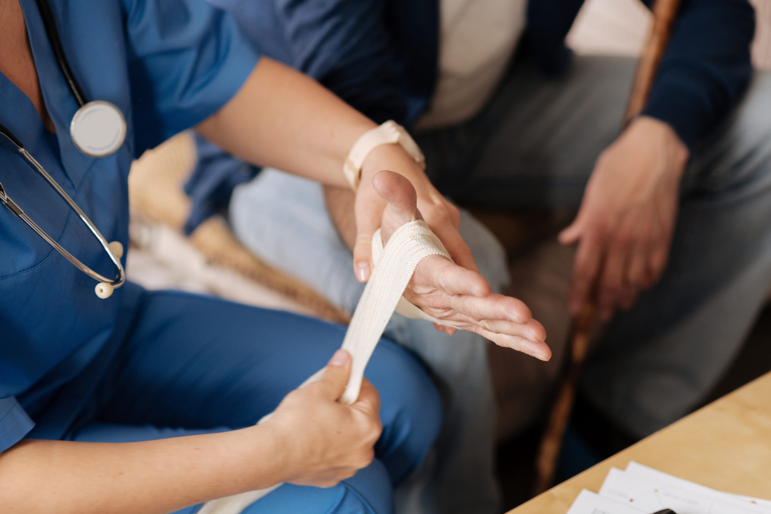 Gentle experienced doctor treating her patients injury