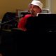 Cypress Cove IT Director Chris Stalbaum Performs for Residents on Lobby Piano